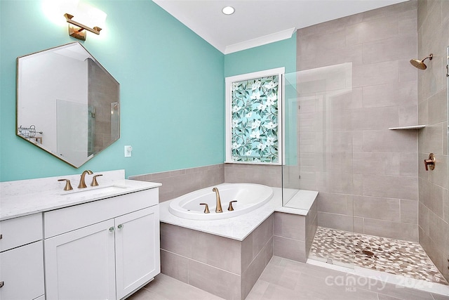 bathroom featuring separate shower and tub, vanity, and ornamental molding