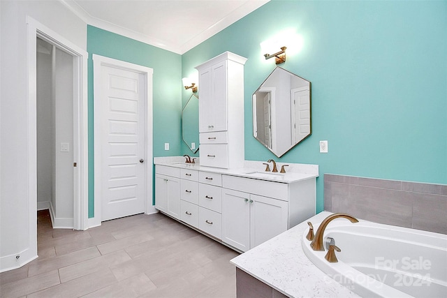 bathroom featuring ornamental molding, vanity, and a bath