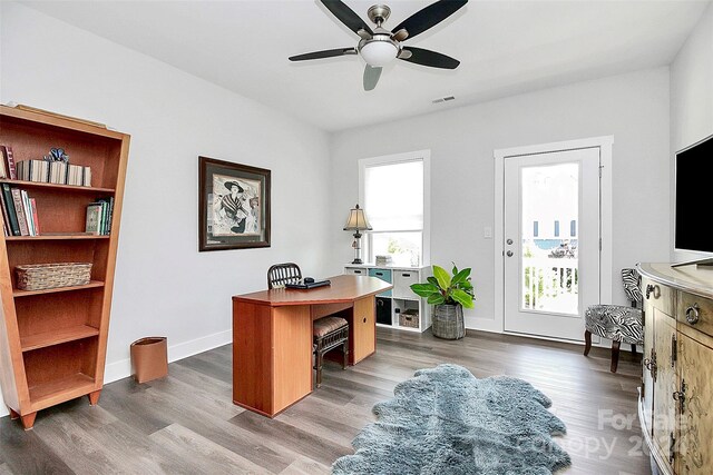 office featuring hardwood / wood-style flooring and ceiling fan