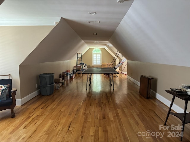 bonus room featuring light hardwood / wood-style floors and lofted ceiling