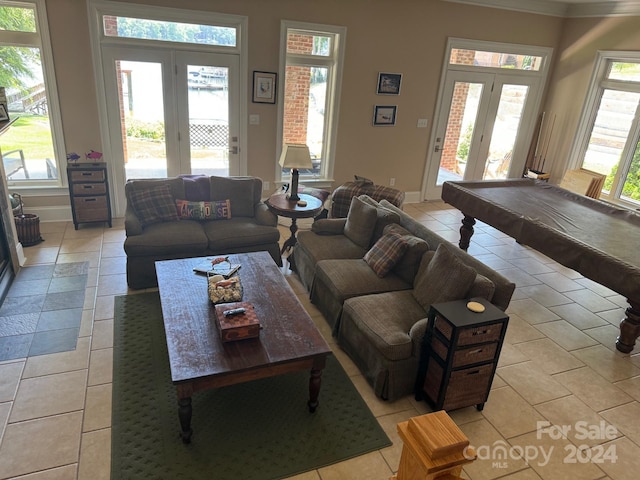 living room with light tile patterned floors, billiards, and french doors