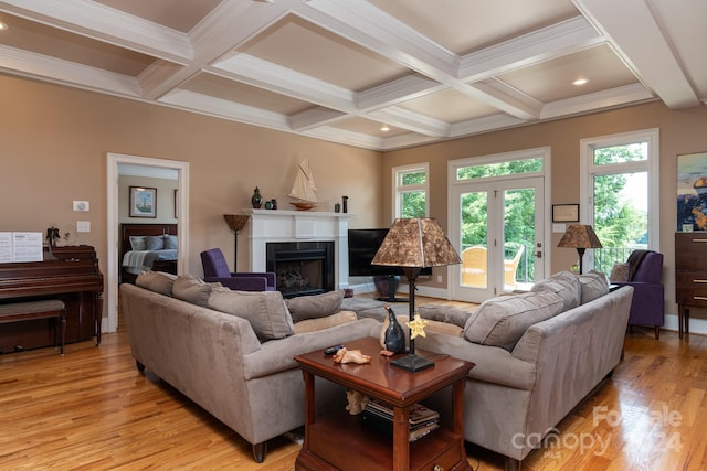 living room with french doors, ornamental molding, coffered ceiling, beam ceiling, and light hardwood / wood-style floors