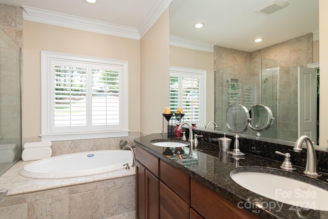 bathroom with vanity, ornamental molding, shower with separate bathtub, and a wealth of natural light