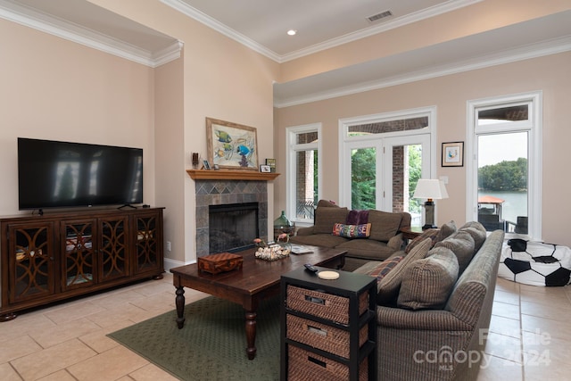 tiled living room with a fireplace and ornamental molding