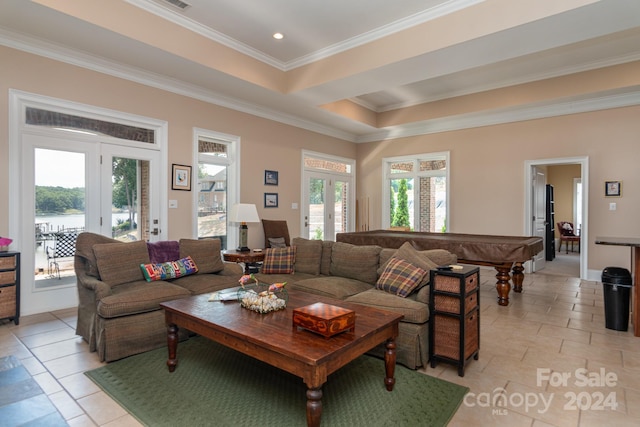 tiled living room with french doors and ornamental molding