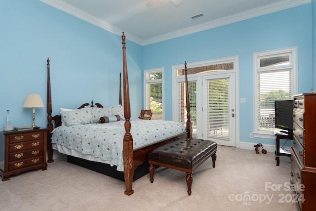 bedroom featuring ceiling fan, access to outside, multiple windows, light carpet, and ornamental molding