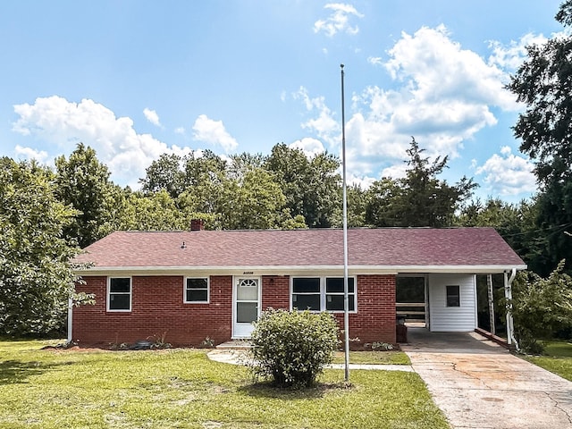 single story home with a front yard and a carport