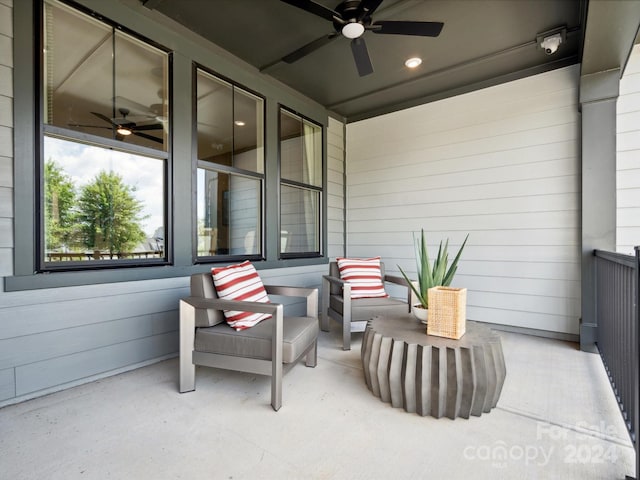 view of patio featuring ceiling fan