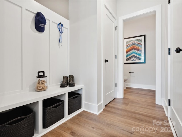 mudroom with light hardwood / wood-style floors