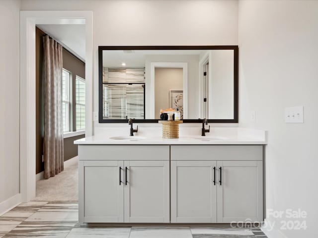 bathroom with vanity and walk in shower