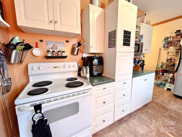 kitchen featuring white cabinets, white electric range oven, and ornamental molding