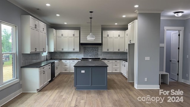 kitchen featuring white cabinets, pendant lighting, a center island, and dishwasher