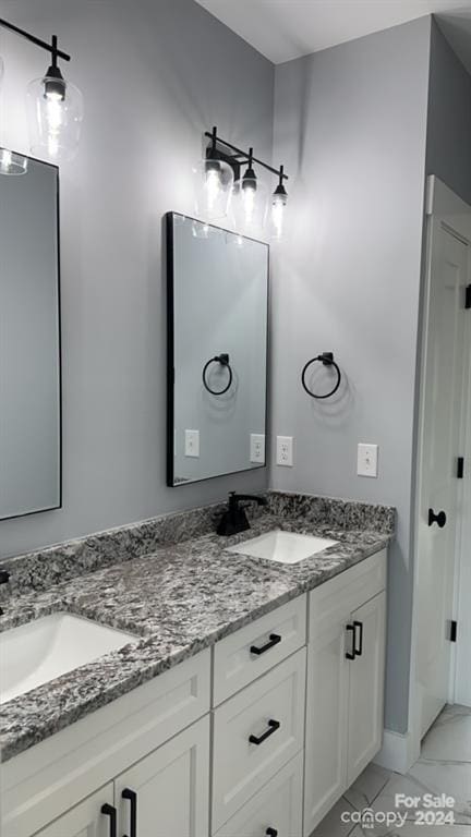 bathroom with vanity and tile patterned flooring