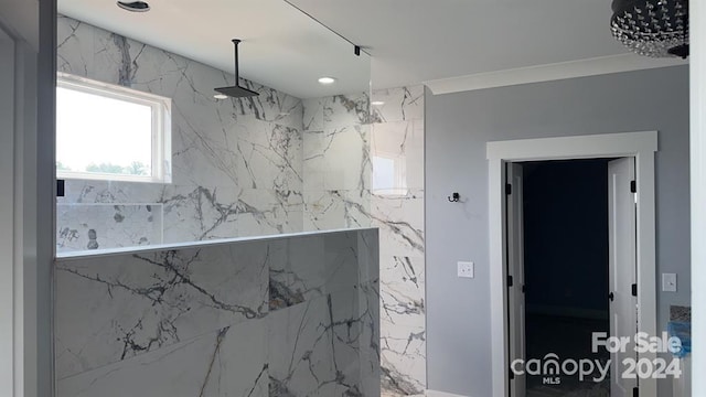 interior space featuring ornamental molding and walk in shower