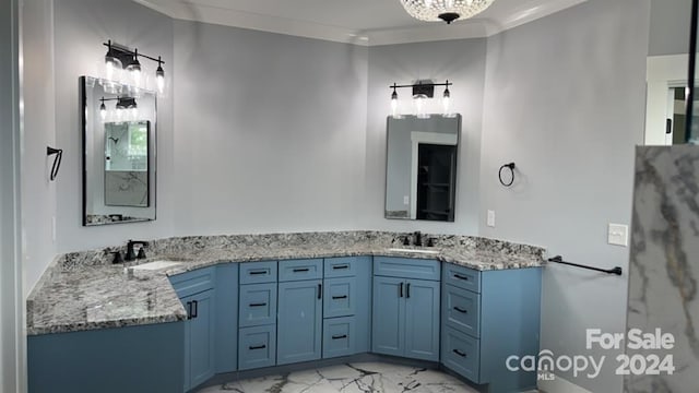 bathroom featuring ornamental molding and vanity