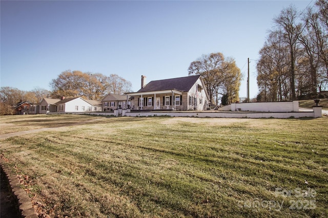 view of front facade with a porch and a front yard