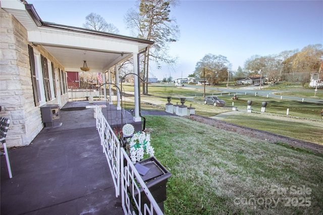 view of yard featuring covered porch