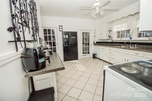 kitchen with white appliances, sink, ceiling fan, light tile patterned flooring, and white cabinetry