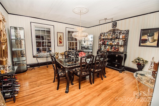 dining room featuring a notable chandelier and wood-type flooring