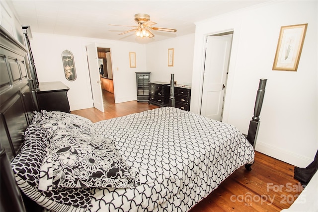 bedroom with ceiling fan and dark wood-type flooring