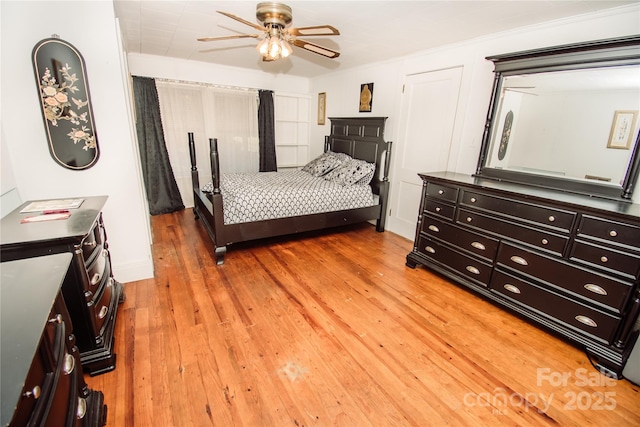 bedroom with hardwood / wood-style floors and ceiling fan