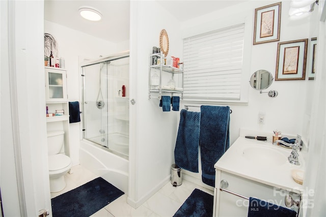 full bathroom with tile patterned flooring, vanity, toilet, and enclosed tub / shower combo