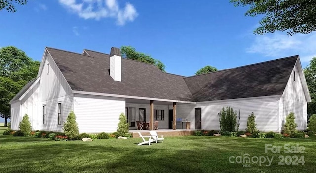 back of house featuring a lawn and a porch