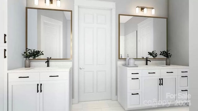 bathroom featuring tile patterned flooring and vanity