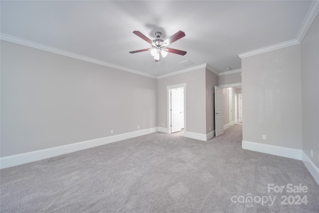 carpeted empty room with crown molding and ceiling fan