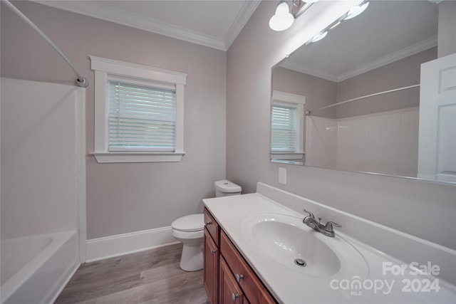 full bathroom featuring shower / tub combination, hardwood / wood-style flooring, ornamental molding, vanity, and toilet