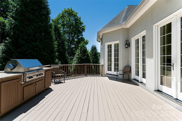 deck featuring grilling area and french doors