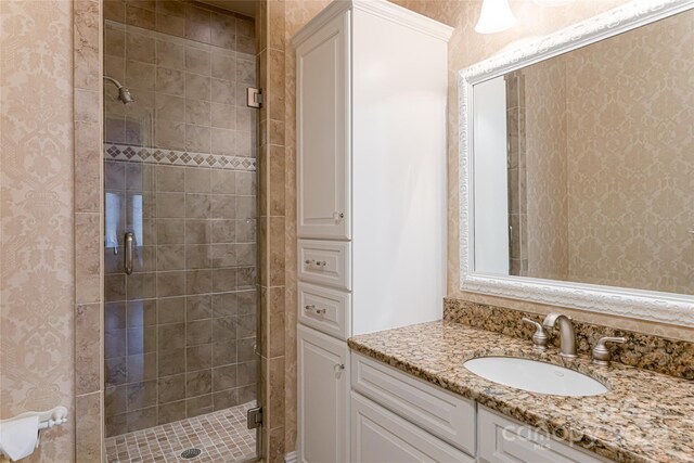 bathroom with vanity and walk in shower