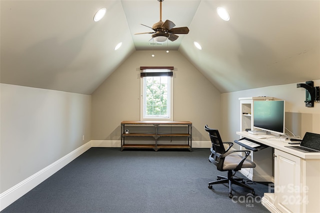 office featuring ceiling fan, dark carpet, and lofted ceiling