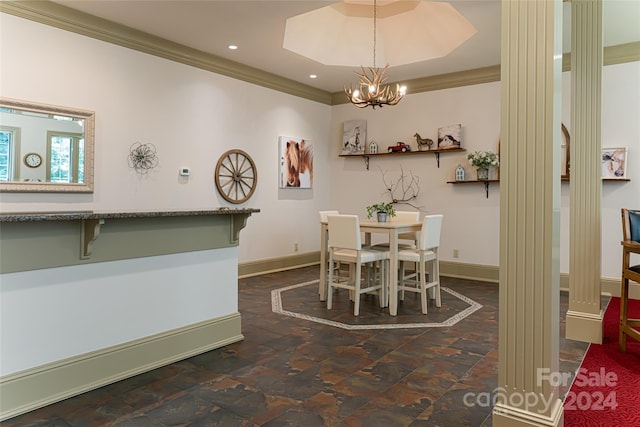 dining space with ornamental molding and an inviting chandelier