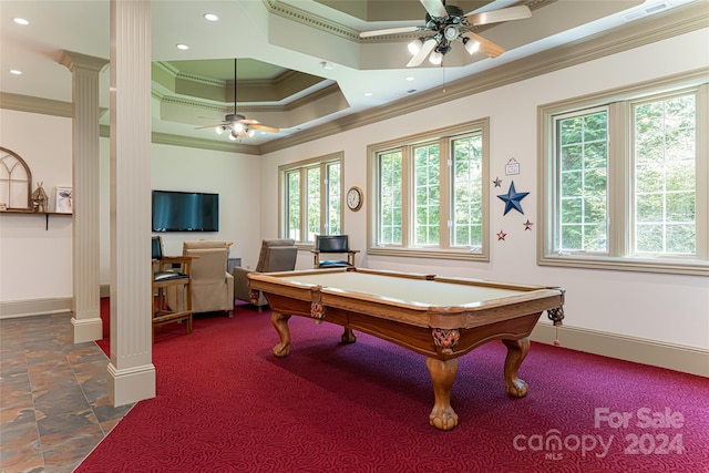 recreation room with ornate columns, ornamental molding, a tray ceiling, ceiling fan, and billiards