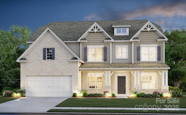 craftsman house with a yard and a garage