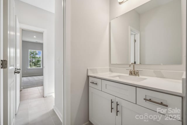 bathroom featuring tile patterned floors and vanity