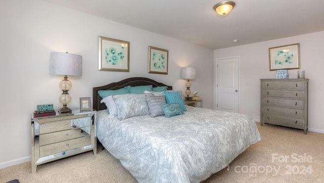 bedroom featuring light carpet