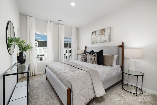 bedroom with light colored carpet