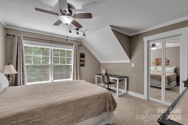 carpeted bedroom featuring ceiling fan and lofted ceiling