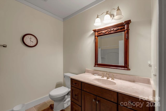 bathroom featuring toilet, vanity, tile patterned floors, and ornamental molding