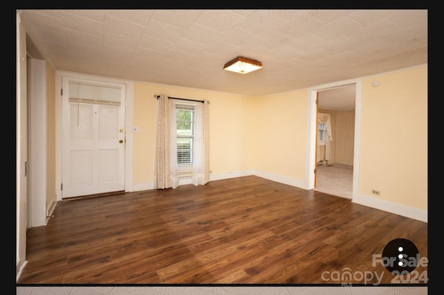 empty room featuring dark hardwood / wood-style floors