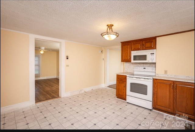 kitchen featuring backsplash, white appliances, pendant lighting, and ceiling fan