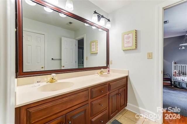 bathroom with vanity and tile patterned flooring