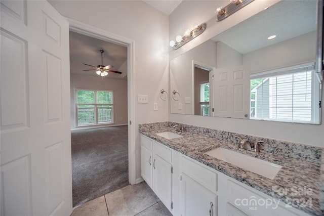 bathroom featuring ceiling fan, tile patterned flooring, and vanity