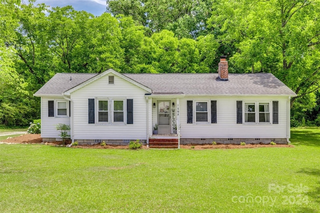 ranch-style house with a front lawn