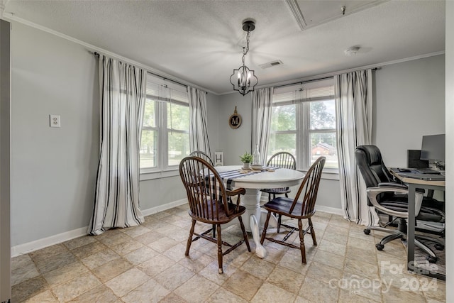 dining space with crown molding, a textured ceiling, and a chandelier