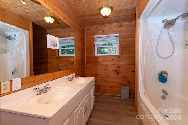 bathroom with wooden walls, shower / bathing tub combination, and wood ceiling