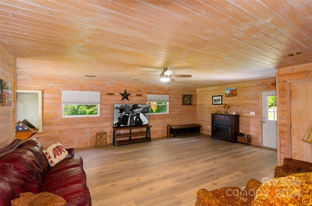 living room featuring hardwood / wood-style floors, ceiling fan, plenty of natural light, and wood ceiling