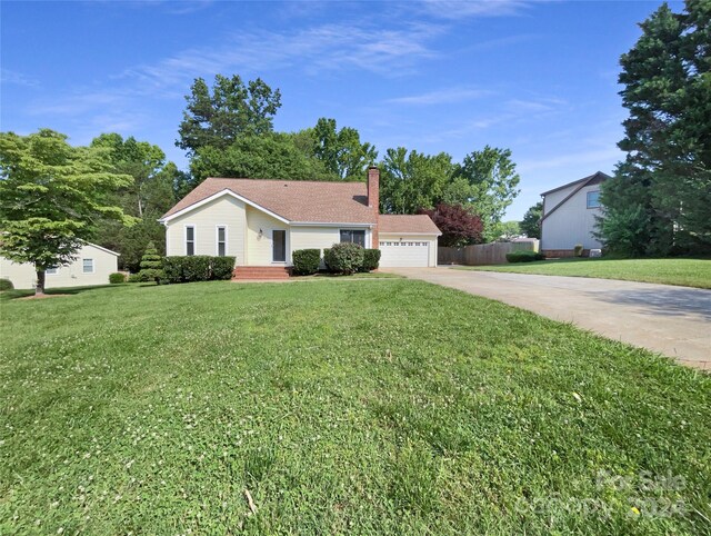 ranch-style home with a garage and a front yard